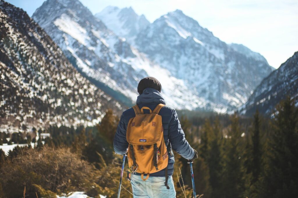 Men's Blue Leather Jacket and Brown Backpack

