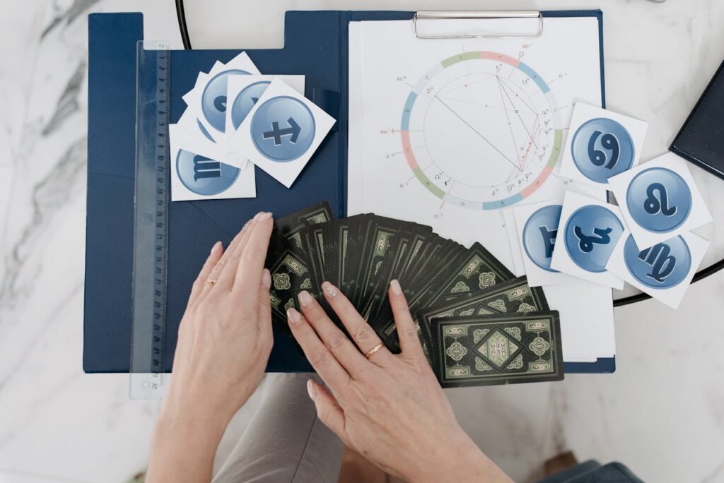 Woman Spreading Cards for a Tarot Reading
