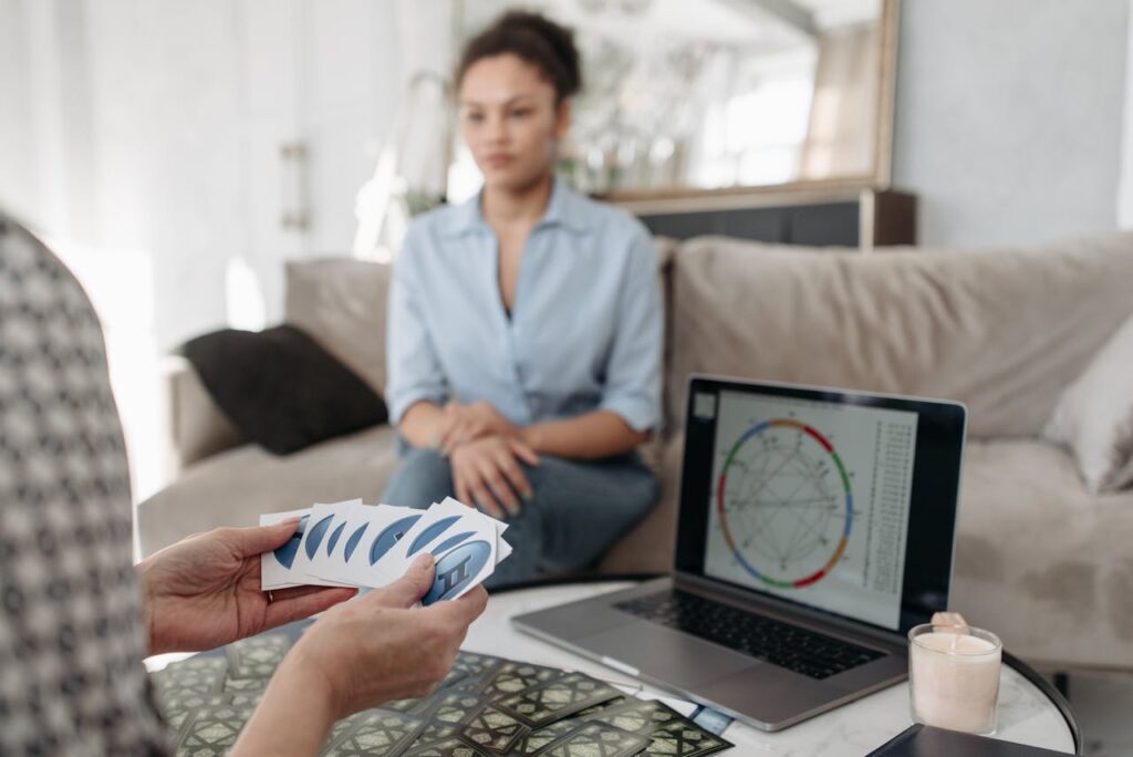 Woman Holding Cards with Star Signs Symbols
