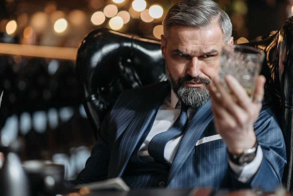 An Angry Man Staring at the Whiskey Glass
