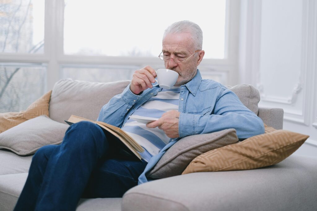 elderly man relaxing on a couch
