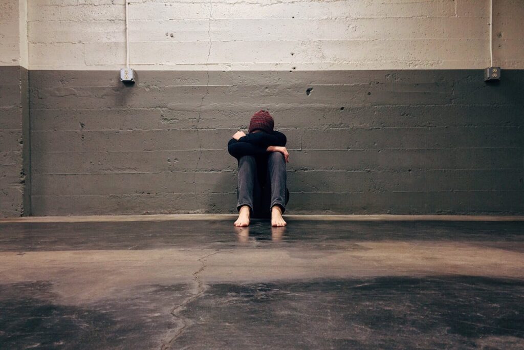 Person Leaning on Wall
