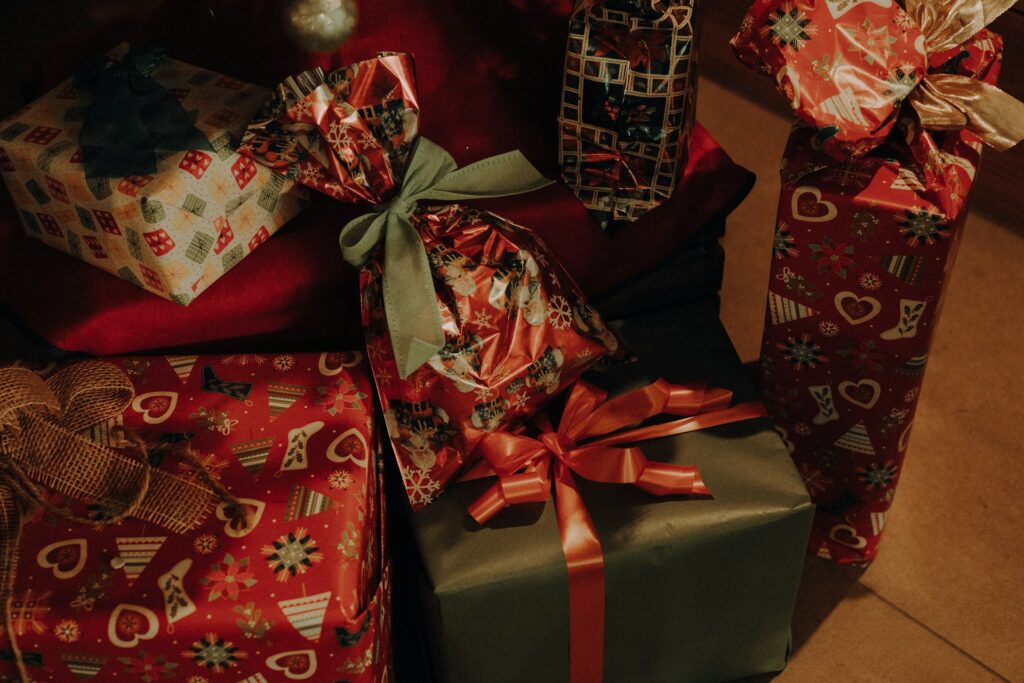 a pile of wrapped presents sitting next to each other
