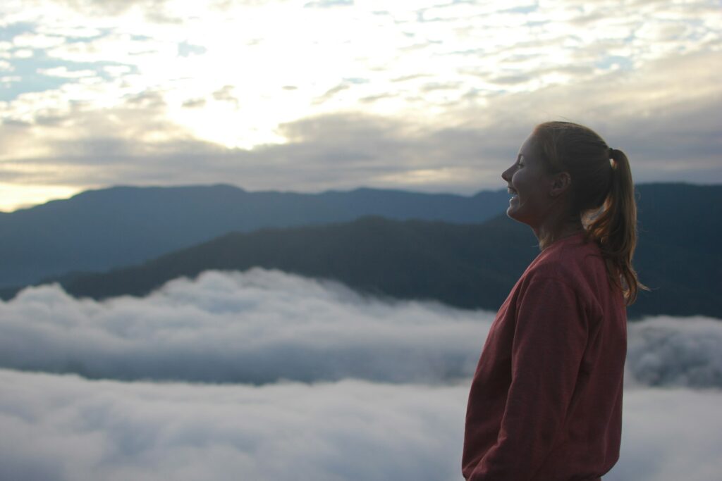 a person looking at the clouds
