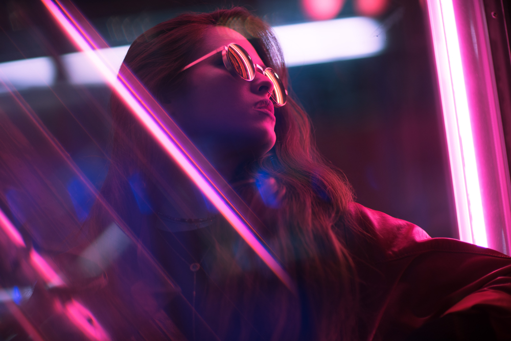 Cinematic night portrait of girl and neon lights