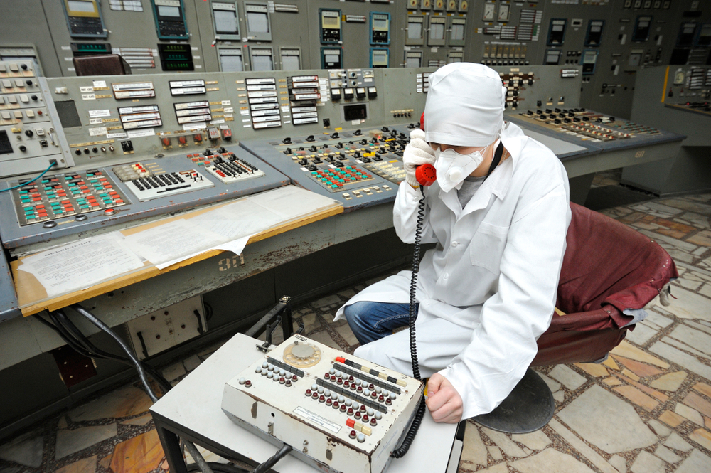 At the control operations room. Operator holds a receiver calling on the phone. Press-tour to Chernobyl Nuclear Power Plant for mass-media. April 20, 2018. Chernobyl, Ukraine
