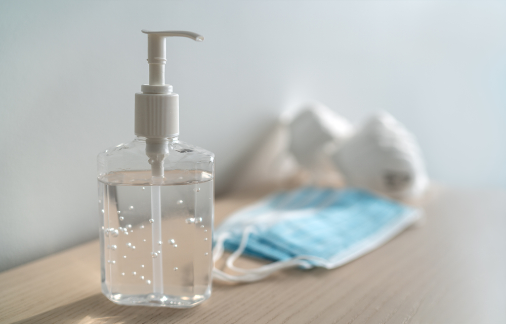 Coronavirus corona virus prevention travel surgical masks and hand sanitizer gel for hand hygiene spread protection.
