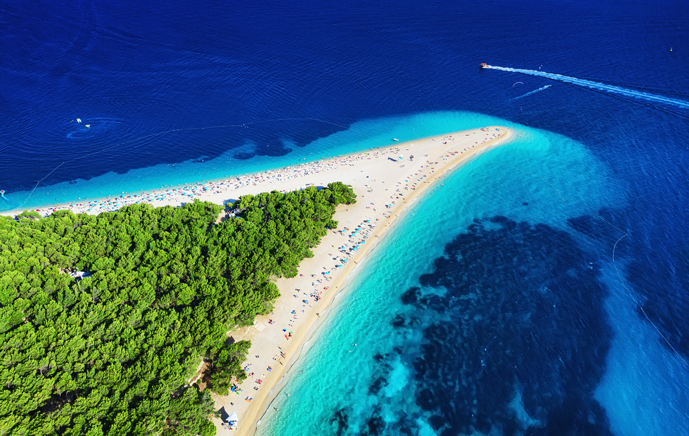 Croatia, Hvar island, Bol. Panoramic aerial view at the Zlatni Rat. Beach and sea from air. Famous place in Croatia. Summer seascape from drone. Travel