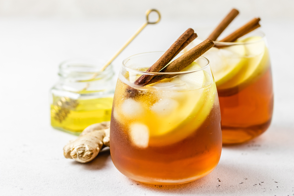 Ginger cinnamon iced tea in glasses. Space ofr text.
