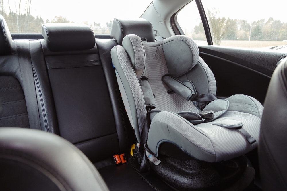 Child car seat for safety in the rear passenger seat of a car.
