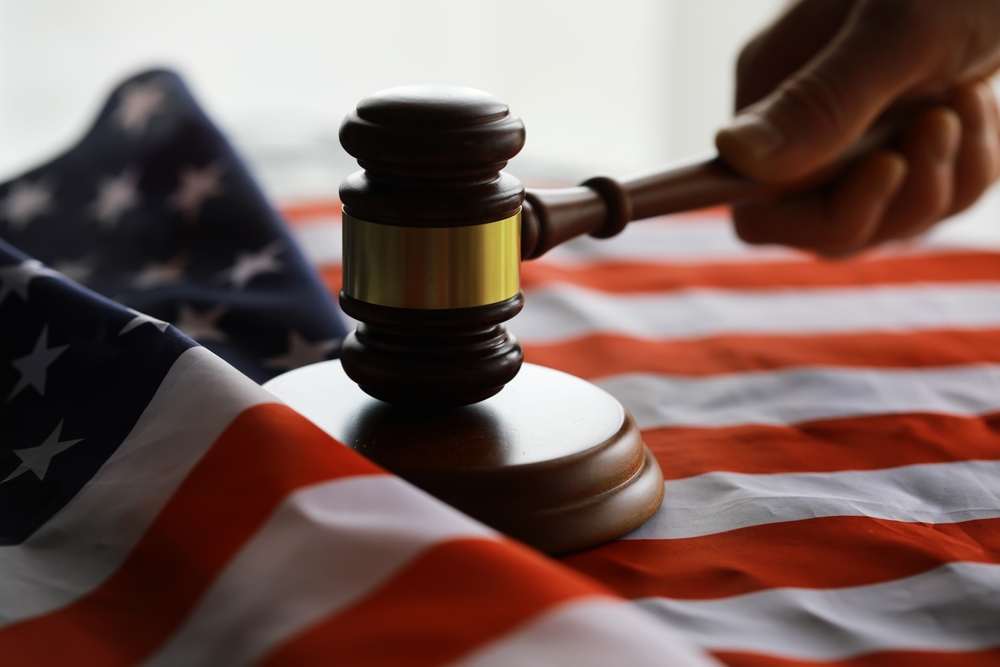Judge's gavel on the table in focus. Cropped view of Judge's hammer for attention and verdict, justice judgment at courts.