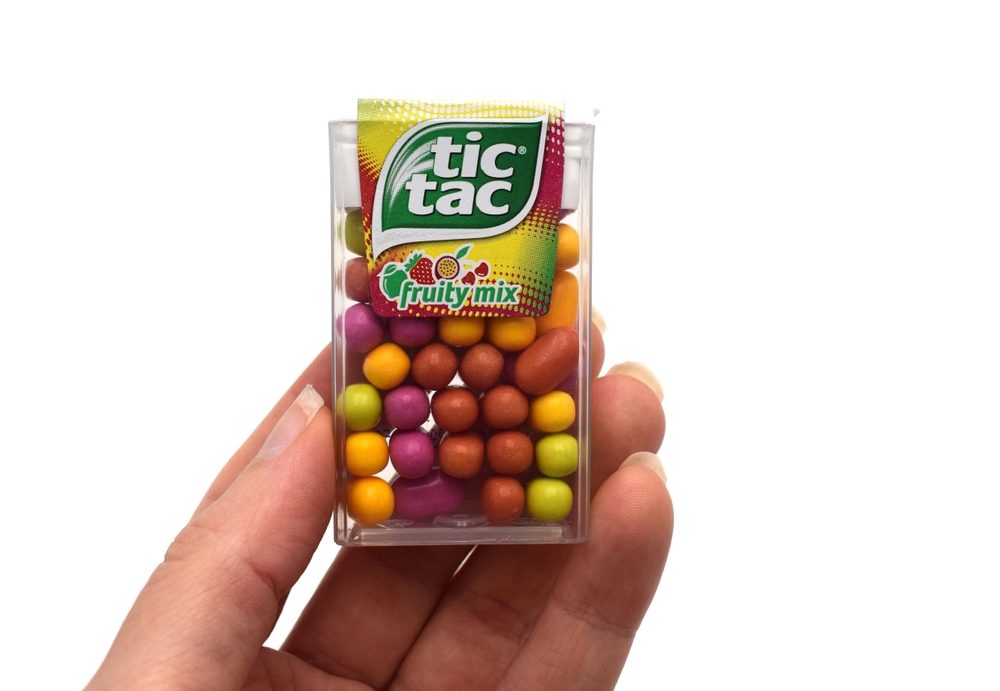 Norway 7 december 2023: Tic Tac Fruity mix jelly white beans candy package product in a box container