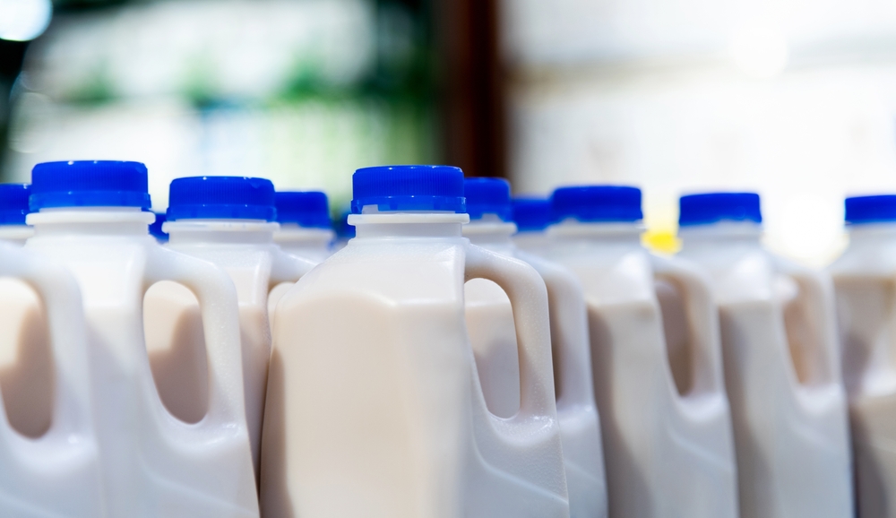 Milk bottles on the supermarket shelf
