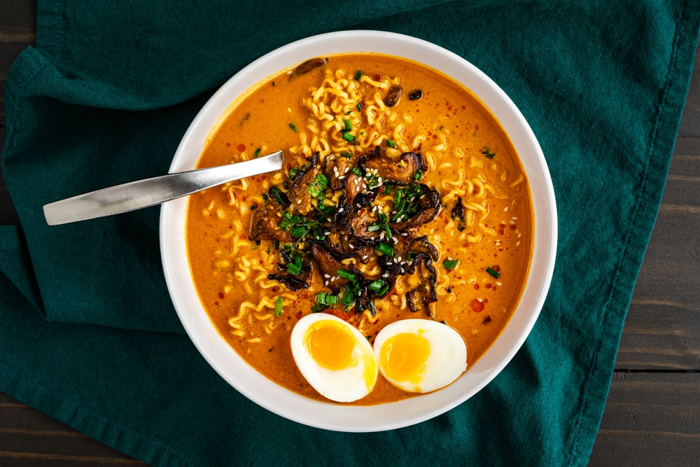 Coconut Curry Ramen with Soft Boiled Egg and Mushrooms: Thai-style ramen noodles in hot and spicy broth broth topped with shiitake mushrooms