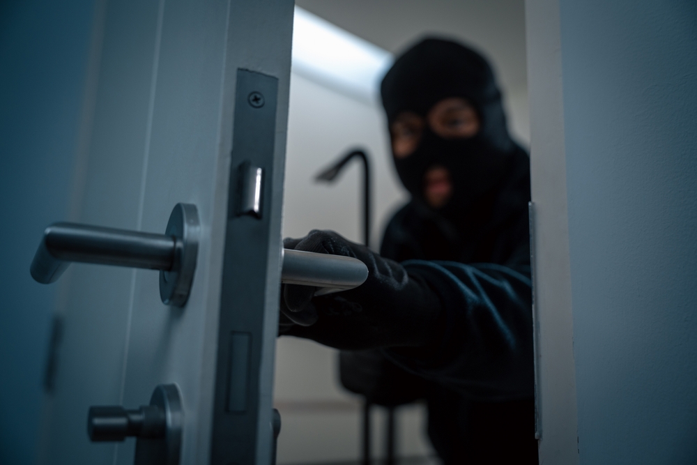 Thief in uniform black jacket various action housebreak. The Robber terrorism criminal escapes with balaclava and crowbar entering a house for stealing Housebreak at night