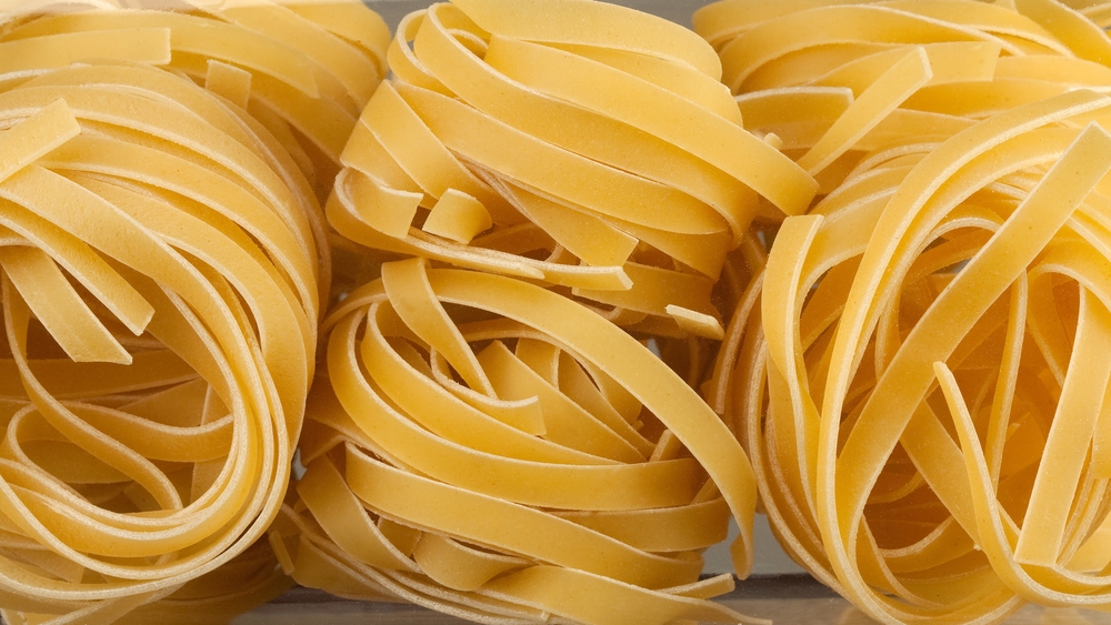 Italian pasta packaging window, Fettuccine pasta, close up, not cooked
