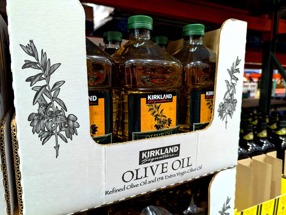 Apex, North Carolina - May 1 2025: Kirkland Signature Olive Oil Bottles on Shelf at Costco
