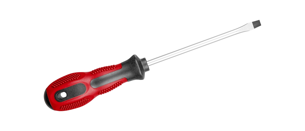 A flathead screwdriver with a Red black handle is perfect for repair tasks. Its ergonomic grip provides comfort during extended use on isolated white background close-up