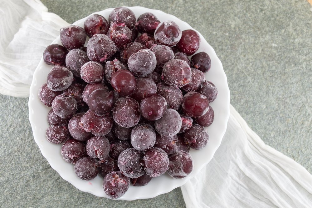 Frozen grapes served in a white bowl
