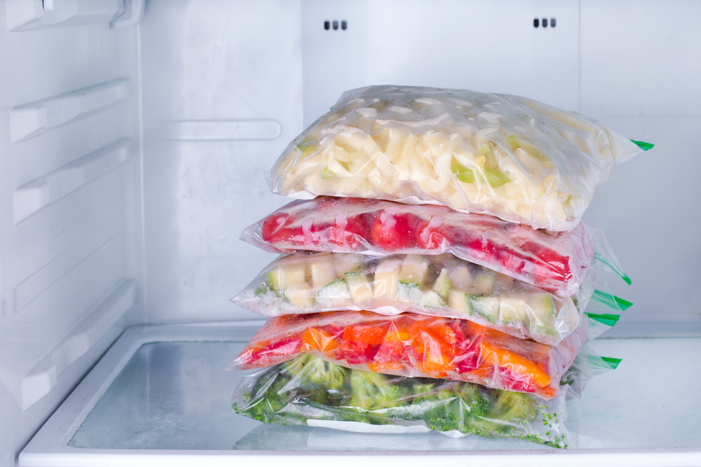 Frozen vegetables in bags in refrigerator
