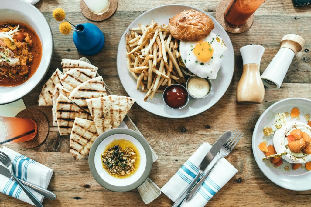 food lot near table decors in brown wooden table close-up photography
