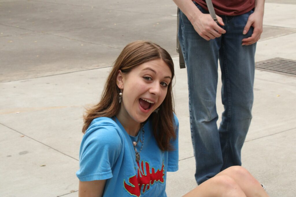 a girl sitting on the ground