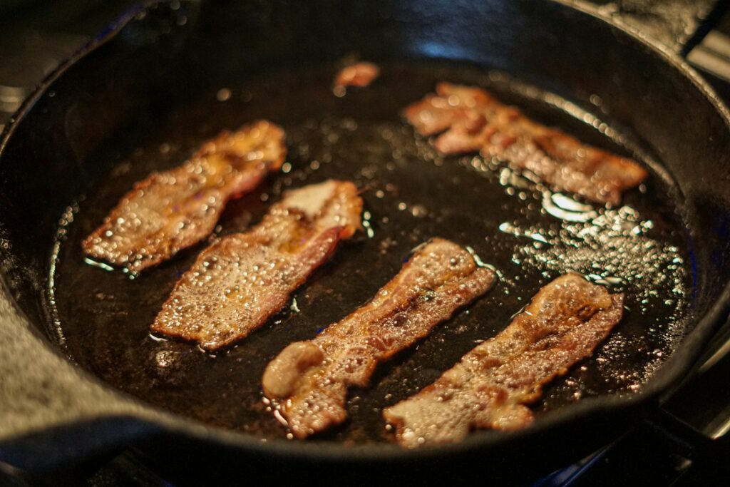 fried meat on black pan
