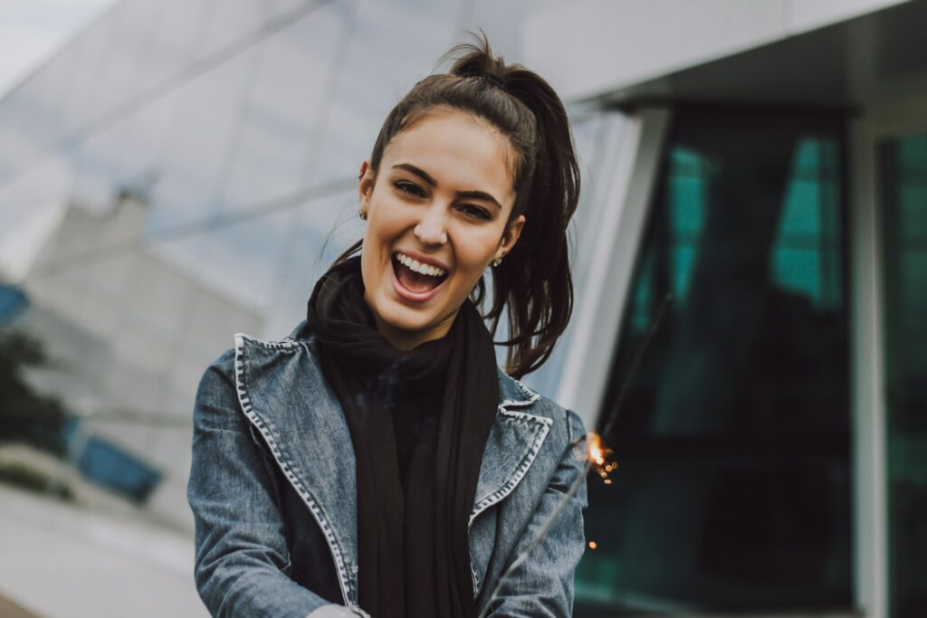 woman wearing gray denim jacket and black scarf
