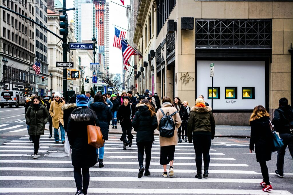 people passing on road during daytime
