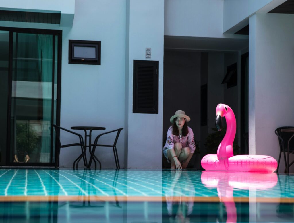 flamingo inflatable tube on swimming pool

