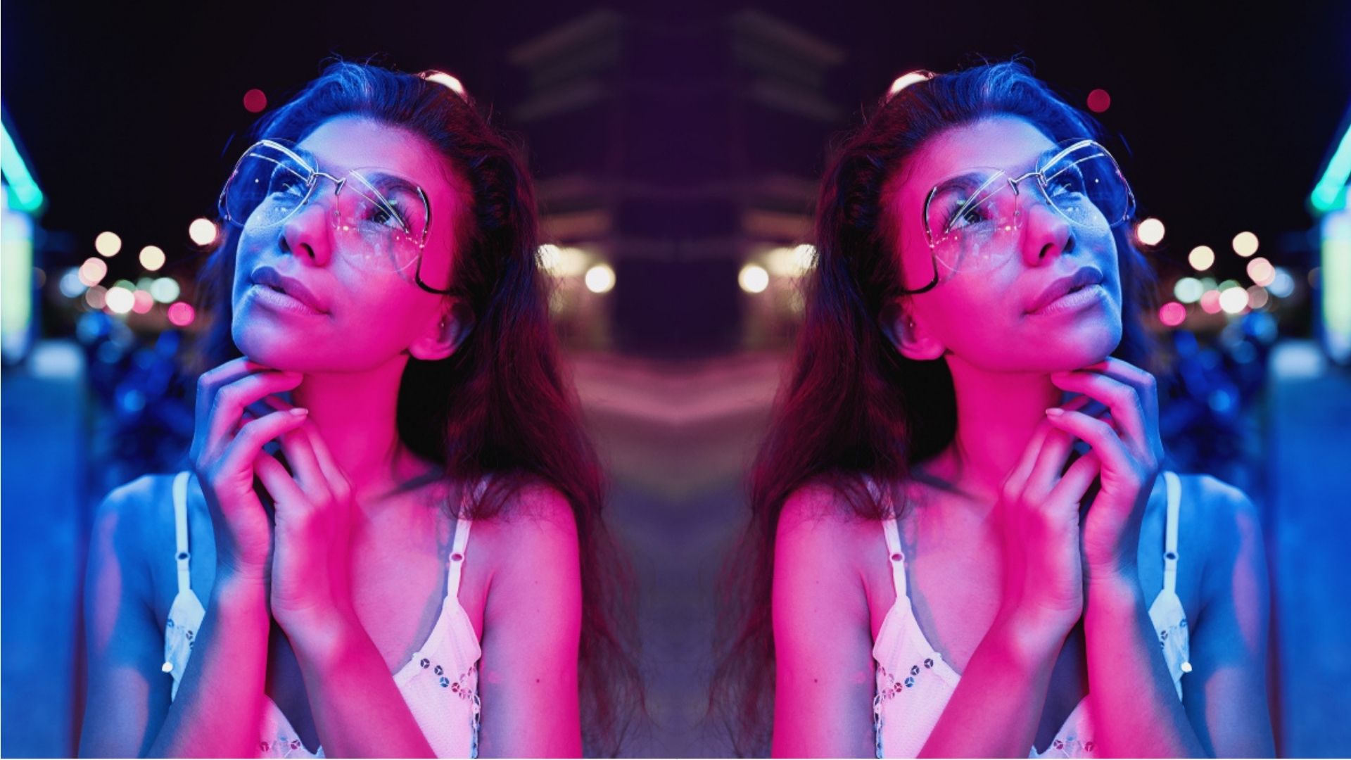 portrait of a beautiful young woman with glasses in futuristic neon light