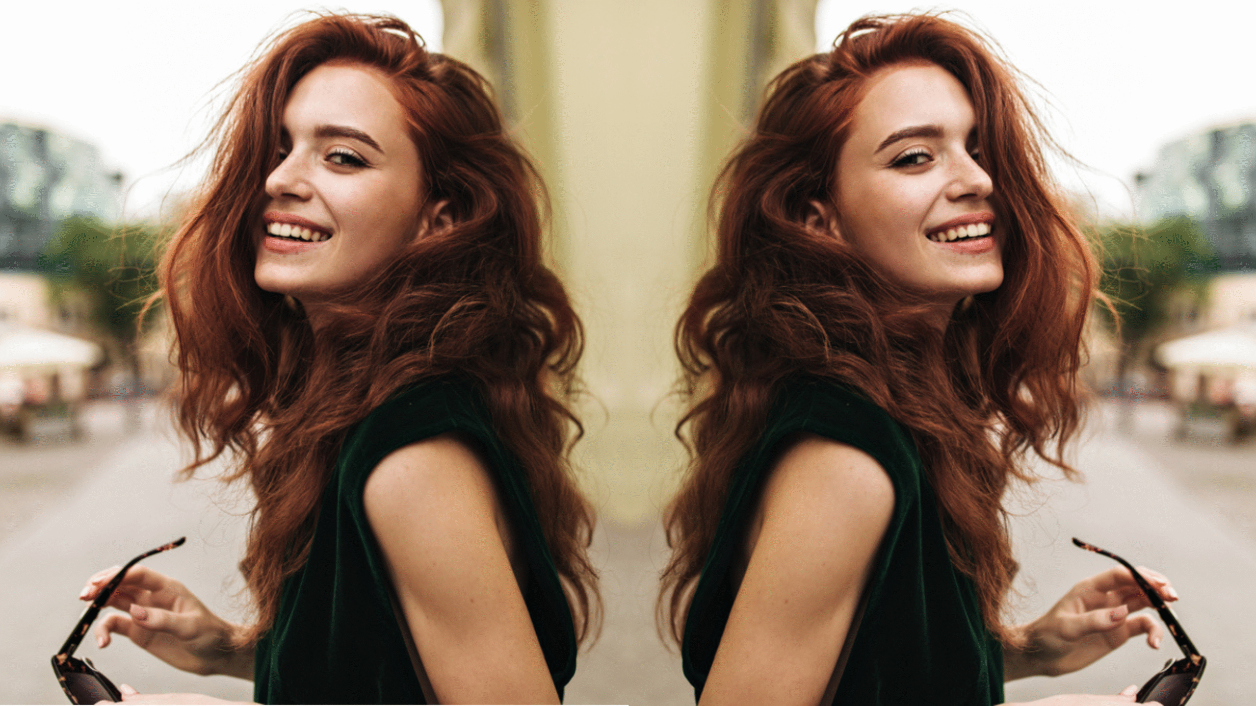 Attractive woman in dark green outfit smiling outside