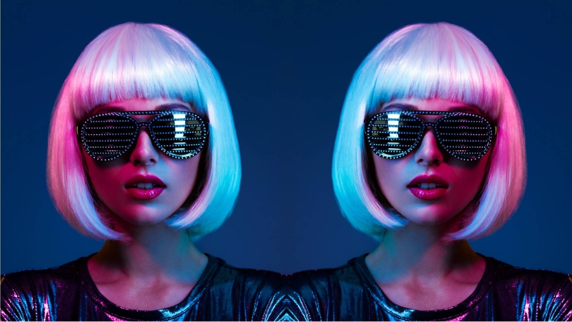 Stylish blonde in shiny dress and sunglasses with stresses. Closeup face of beautiful fashionable woman in white wig. Art portrait of an young attractive model. Fantasy style. Glamour fashion girl