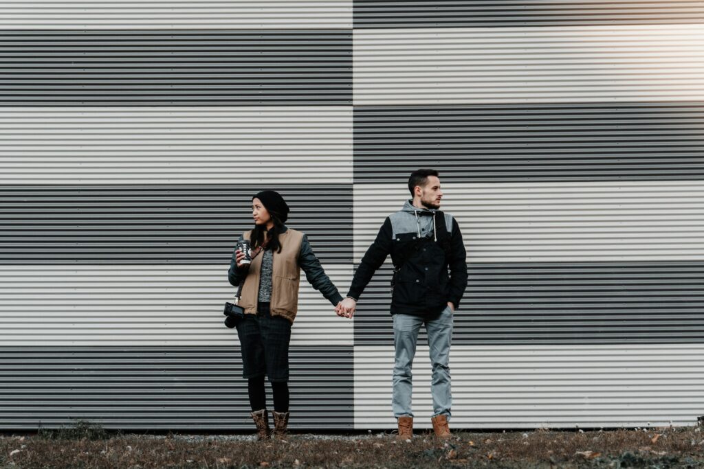 man and woman holding each other's hands
