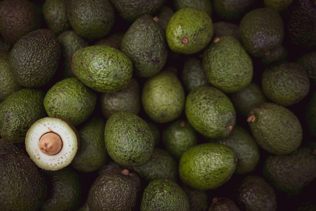 green fruits on black surface
