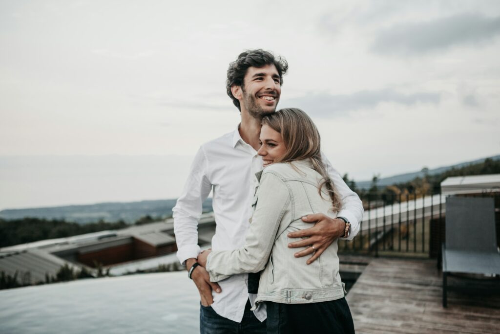 man and woman hugging each other
