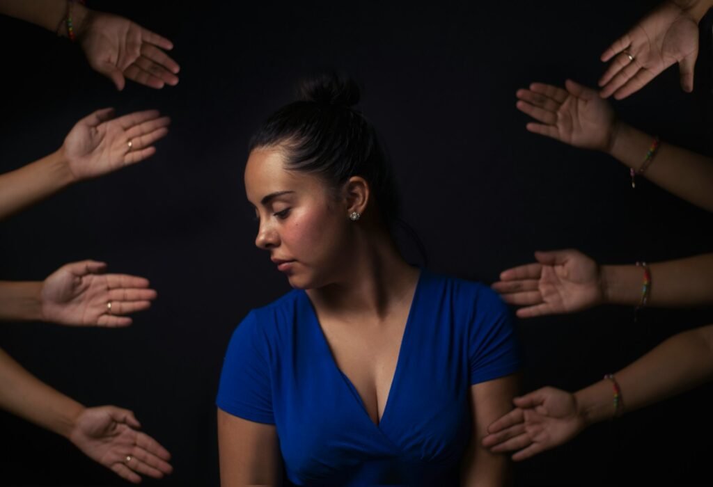 woman wearing blue V-neck short-sleeved top
