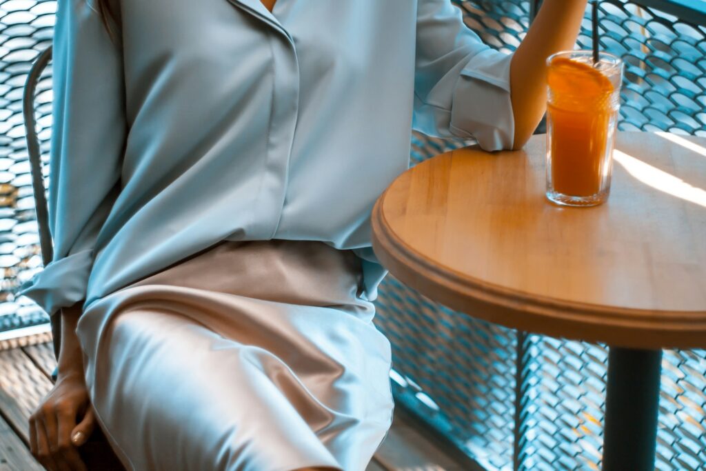 woman sitting near brown table
