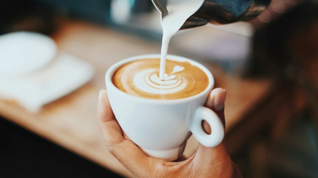 person making latte art

