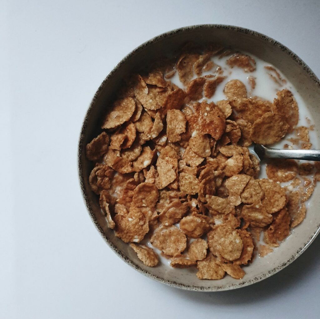 a bowl of cereal with a spoon in it
