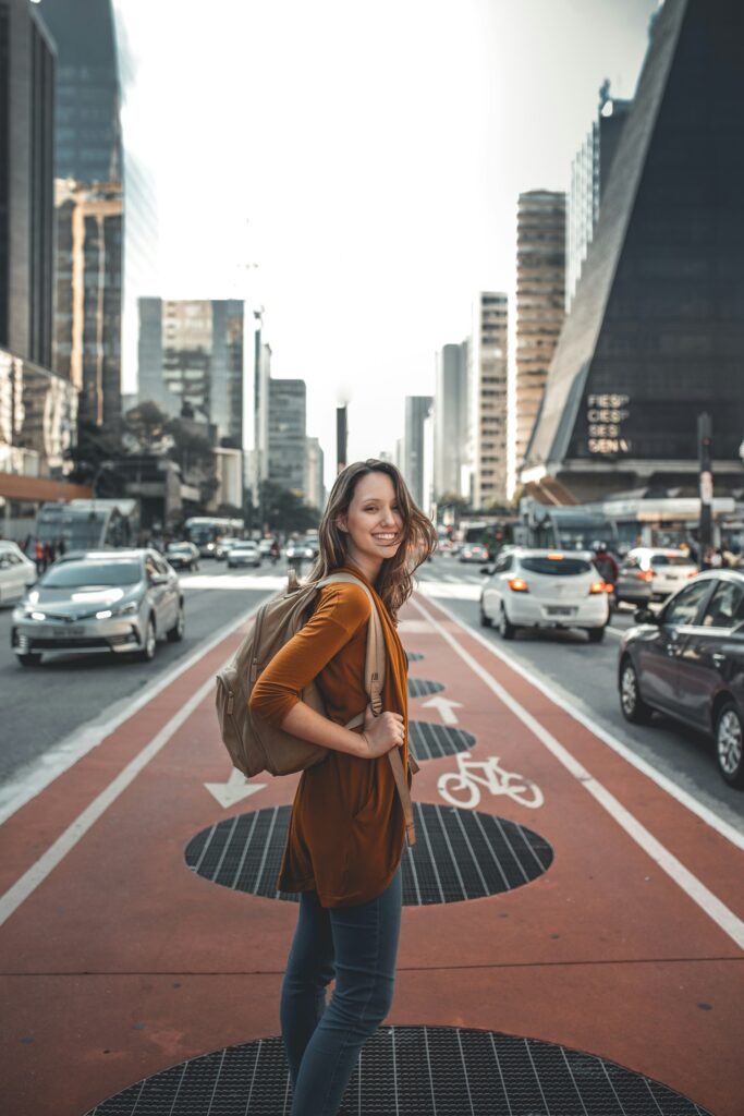woman standing on middle of road

