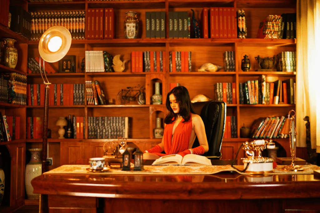 image of a person sitting behind a desk in a lavish office setting