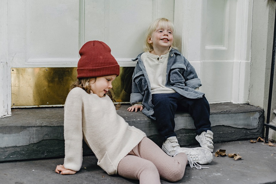 siblings outside being happy, image