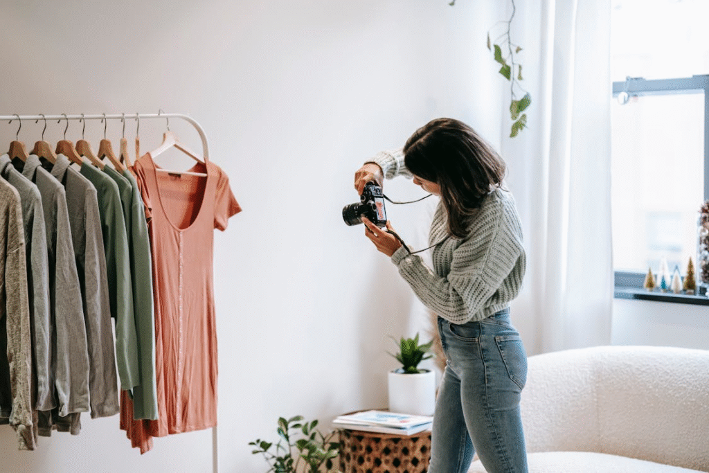 Woman taking photo of clothes
