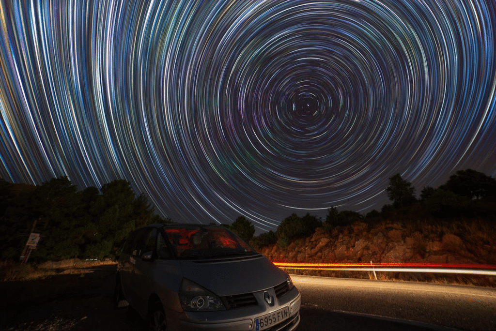 Spectacular Night Sky Star Trails Over Scenic Road