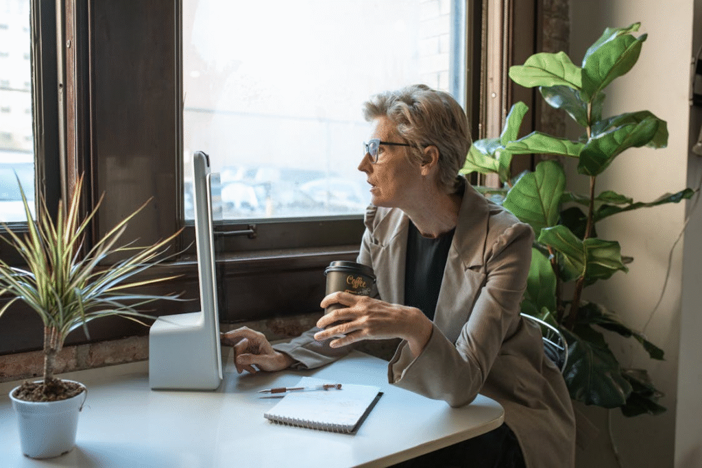 A Senior Businesswoman Using a Computer at Work