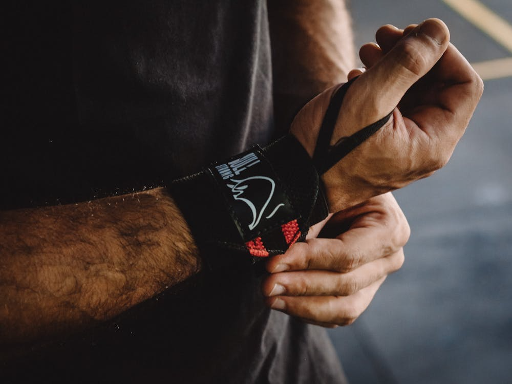 Man Putting on a Wrist Strap