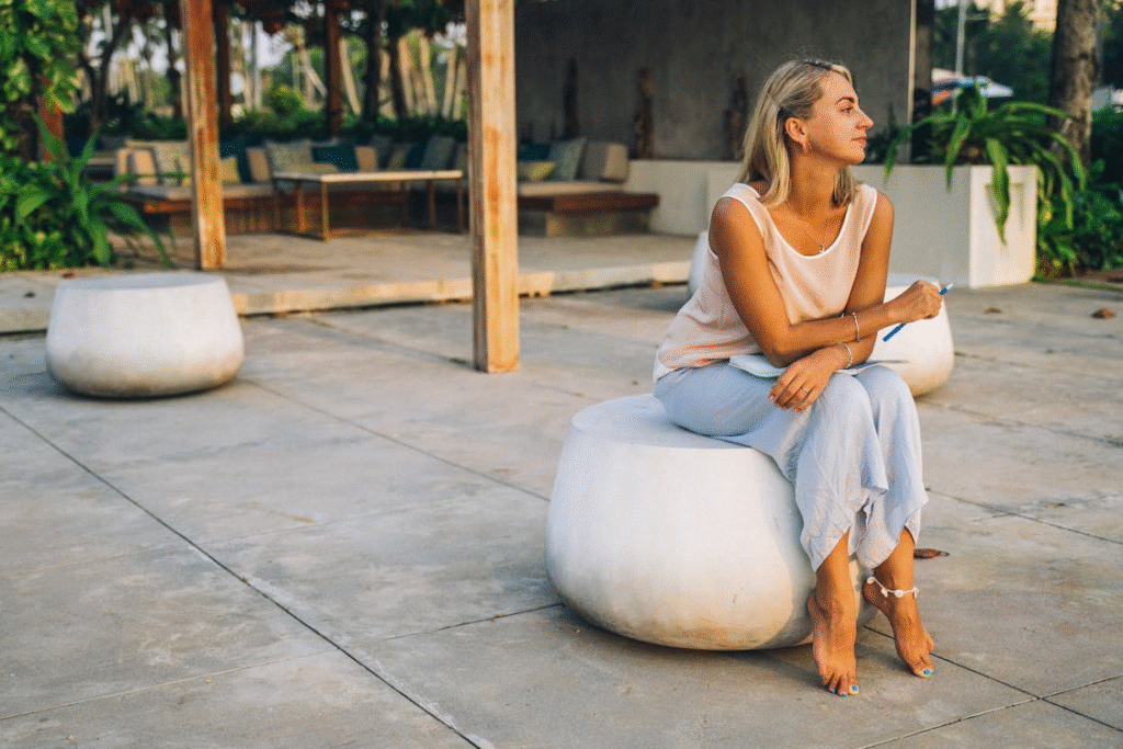 A Blonde Woman Looking Away while Sitting