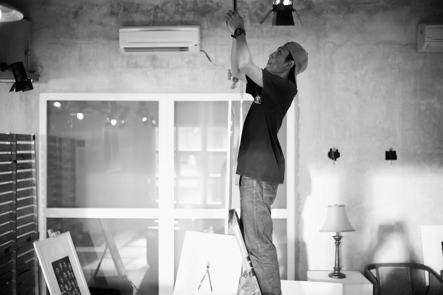 black and white image of a person doing renovations