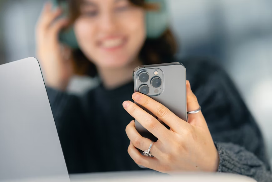 image of a woman holding a smartphone